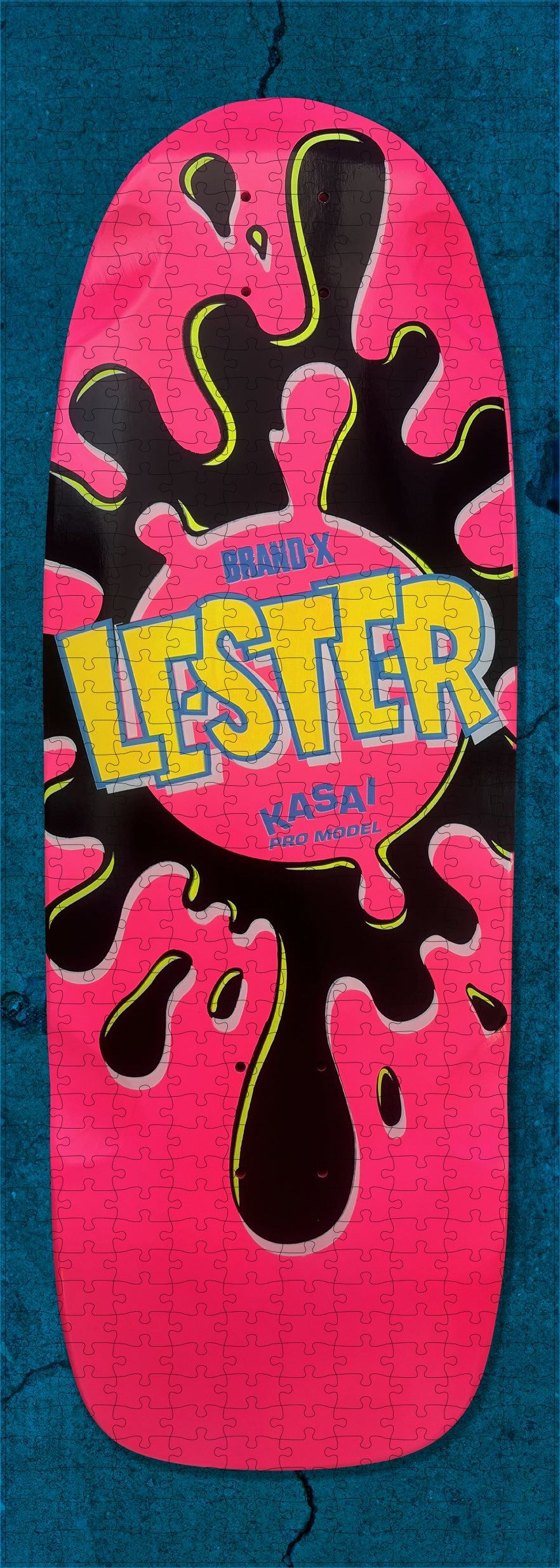 The Lester Green Sk8zzle Skateboard puzzle is a 12"x34" full-sized puzzle of the legendary Lester Splat Graphic.