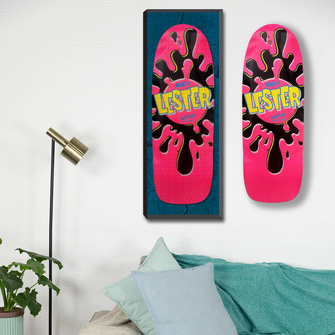 Picture of a Pink Lester Sk8zzle framed  on a skateboard collector wall next to an original Brand-X Pink Lester Skateboard.